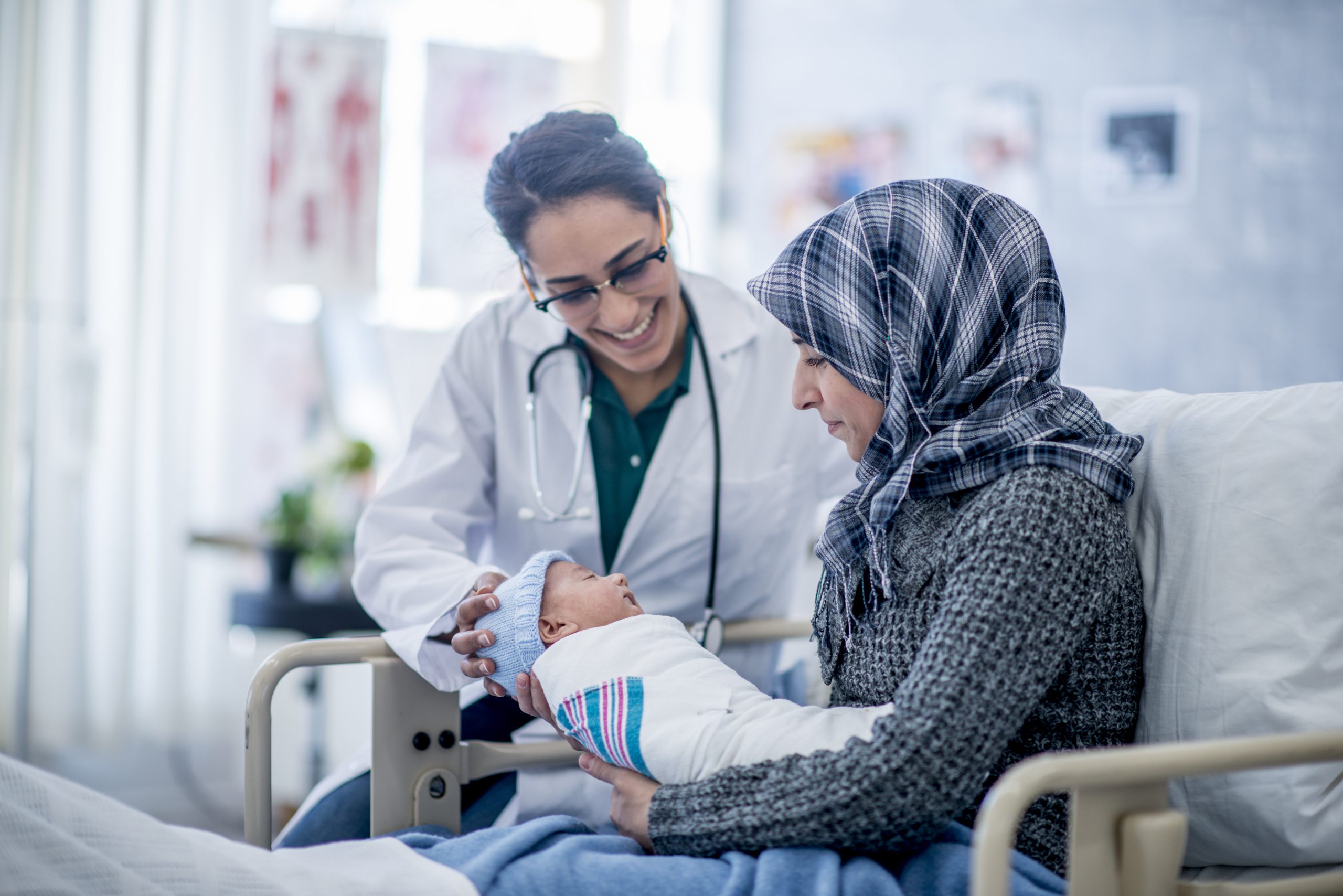 doctor with mother and baby